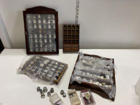A job lot of assorted thimbles and display cases, shipping unavailable