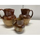 Three Royal Doulton salt glazed jugs, shipping unavailable