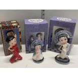 Three boxed Betty Boop figurines