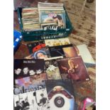 A job lot of assorted mixed genre LP and single records, shipping unavailable