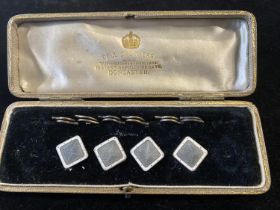 A set of vintage continental silver cased shirt studs with enamel decoration