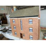 A large good quality scratch built dolls house with a good selection of furniture and accessories