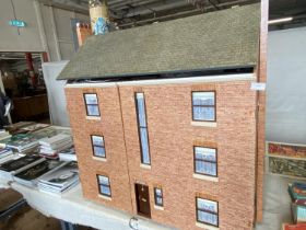 A large good quality scratch built dolls house with a good selection of furniture and accessories