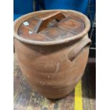 A terracotta lidded urn H54cm.Shipping unavailable