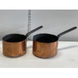 Two antique copper and cast iron pans, shipping unavailable