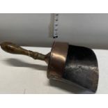 A antique copper coal shovel