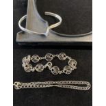 A 925 silver torque bracelet and two other silver bracelets