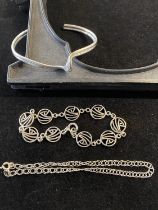 A 925 silver torque bracelet and two other silver bracelets