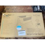 A boxed Cozee bedside crib (unchecked),