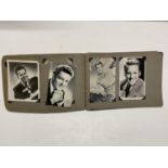 A vintage movie star autograph album with prints