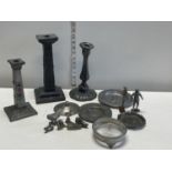 A selection of pewter wares including candlesticks
