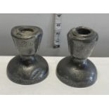 A pair of antique hand planished Tudric pewter candlesticks (a/f)