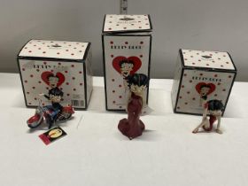 Three boxed Betty Boop figurines