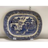 A large Victorian blue and white willow pattern meat plate, 46x37cm, shipping unavailable