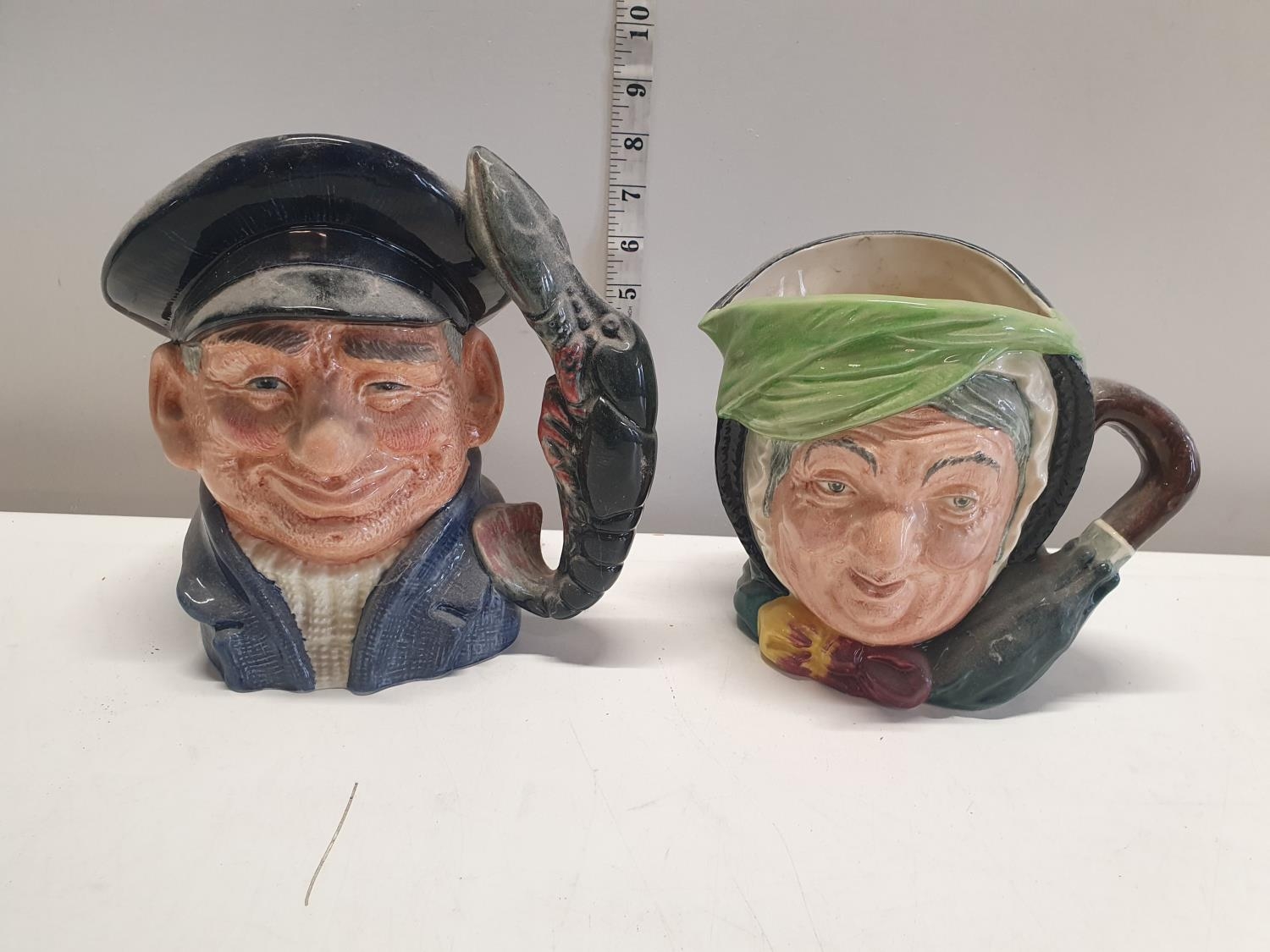 Two Royal Dalton character jugs Lobster Man and Sairey Gamp. Shipping unavailable