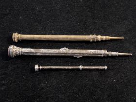 Three antique propelling pencils, smaller one is hallmarked silver