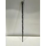A African themed ebonised walking stick, shipping unavailable