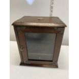 A vintage smokers cabinet with key.Shipping unavailable