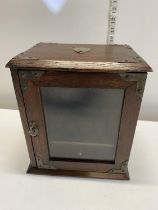 A vintage smokers cabinet with key.Shipping unavailable