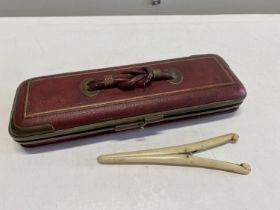 A Antique Art Deco leather glove case complete with stretchers