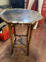 A antique bamboo occasional table with a Japanese themed top, shipping unavailable