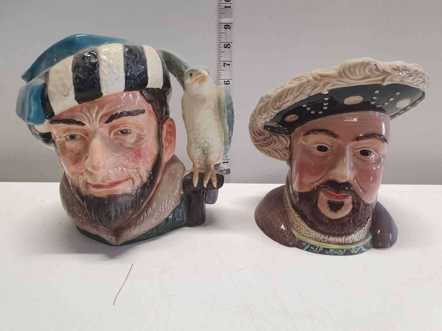 A royal Dalton and a Beswick jug. A Falconer and Henry viii, shipping unavailable