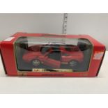 A boxed tropee Ferrari die cast model