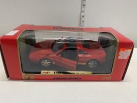 A boxed tropee Ferrari die cast model