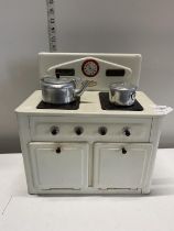 A vintage child's Amersham toys tin plate cooker with accessories, shipping unavailable