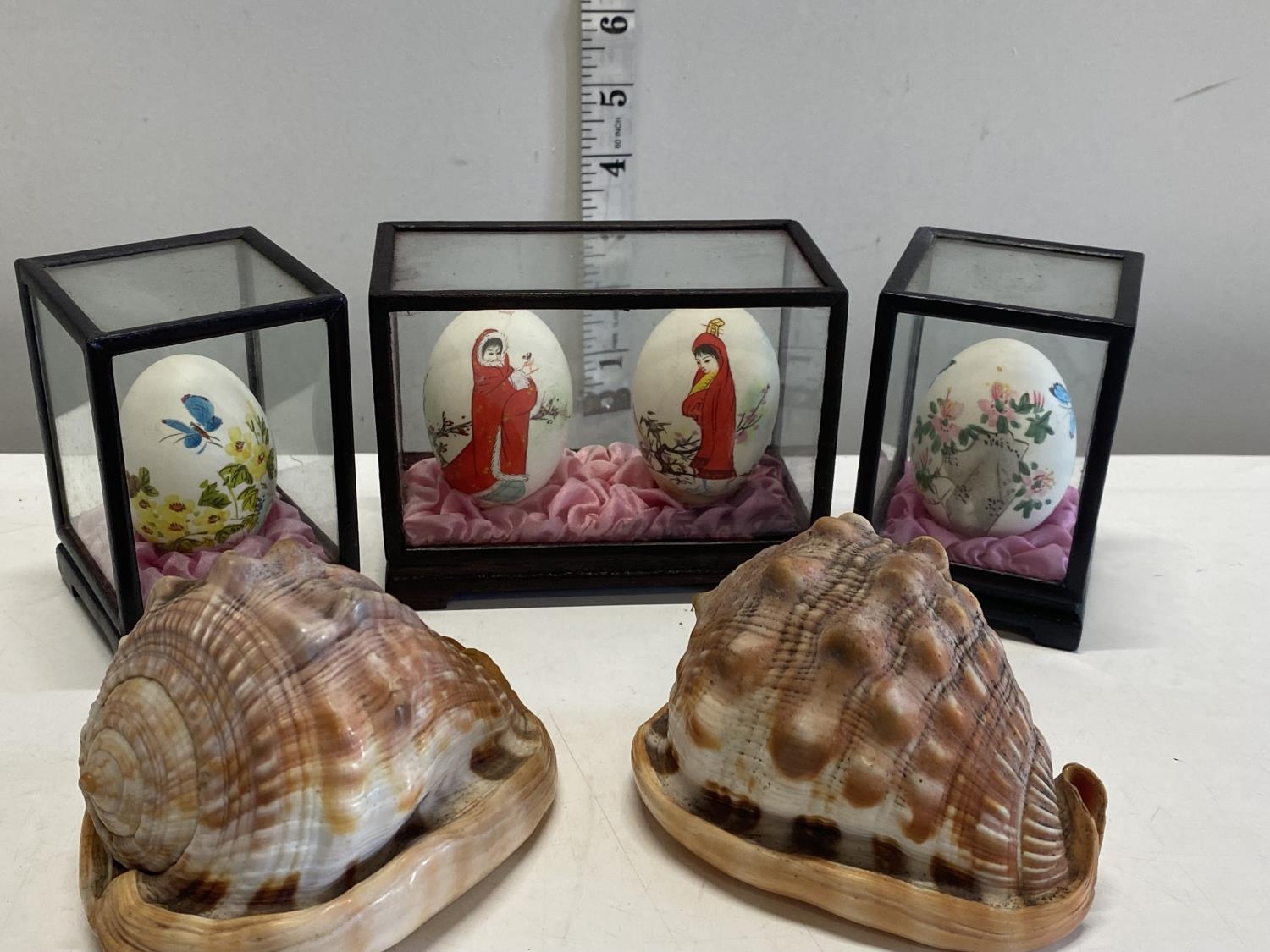 Four cased oriental painted eggs and two shells.Shipping unavailable