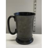 A Victorian pewter tankard