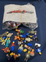 A selection of Lego style figures and a Lego Style racing car building set (unchecked)