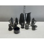 A selection of pewter wares including condiment pots
