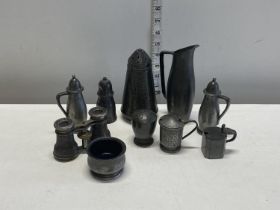 A selection of pewter wares including condiment pots