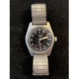 A watch in the style of a Smiths 6B/346 RAF military watch, with broad arrows to dial and case back,