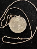 A 1878 Morgan silver Dollar in a 925 silver mount with chain