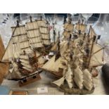 A selection of wooden miniature sailing ships, shipping unavailable