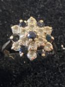 A 9ct gold sapphire and white stone cluster ring size J gross weight 2.30g