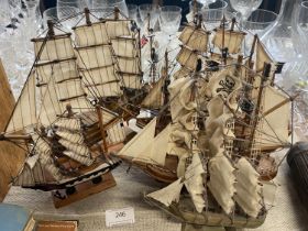 A selection of wooden miniature sailing ships, shipping unavailable