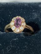 A antique 9ct gold ring set with white stones & amethyst. 1.92 grams