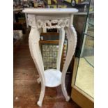 A vintage white painted planter stand. 81cm tall.