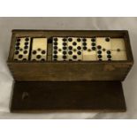 A set of antique bone dominoes.