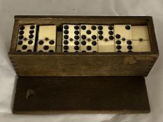 A set of antique bone dominoes.