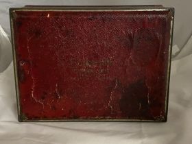 A collectible American Schraffts crimson chest biscuit tin
