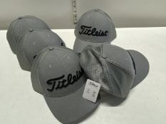 Five new Titleist golfing hats.