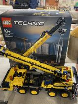 A Lego Technic mobile crane model 42108, with original box etc, shipping unavailable