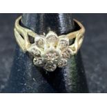 A 9ct gold & diamond cluster ring. 2.65 grams