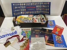 A good mixed box football related items including a 1988 Real Madrid shirt, World Cup & Champions