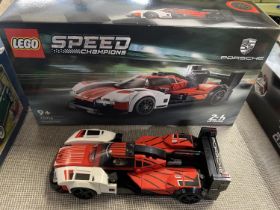 A Lego Speed Champions Porsche 963 model 76916, with original box etc, shipping unavailable