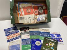 A box full of assorted football programmes from the 1950's onwards.